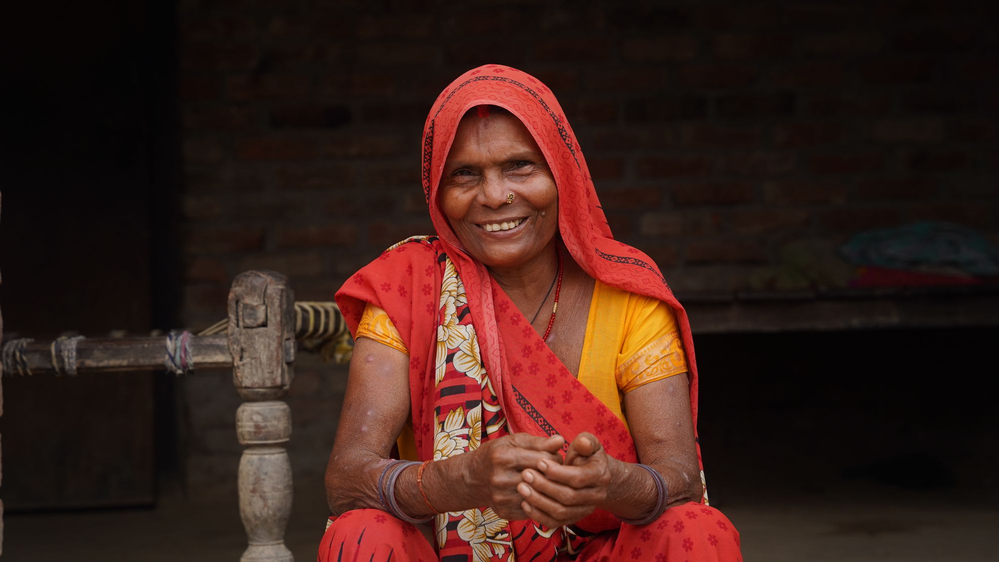 A former patient in Nepal smiling to the camera